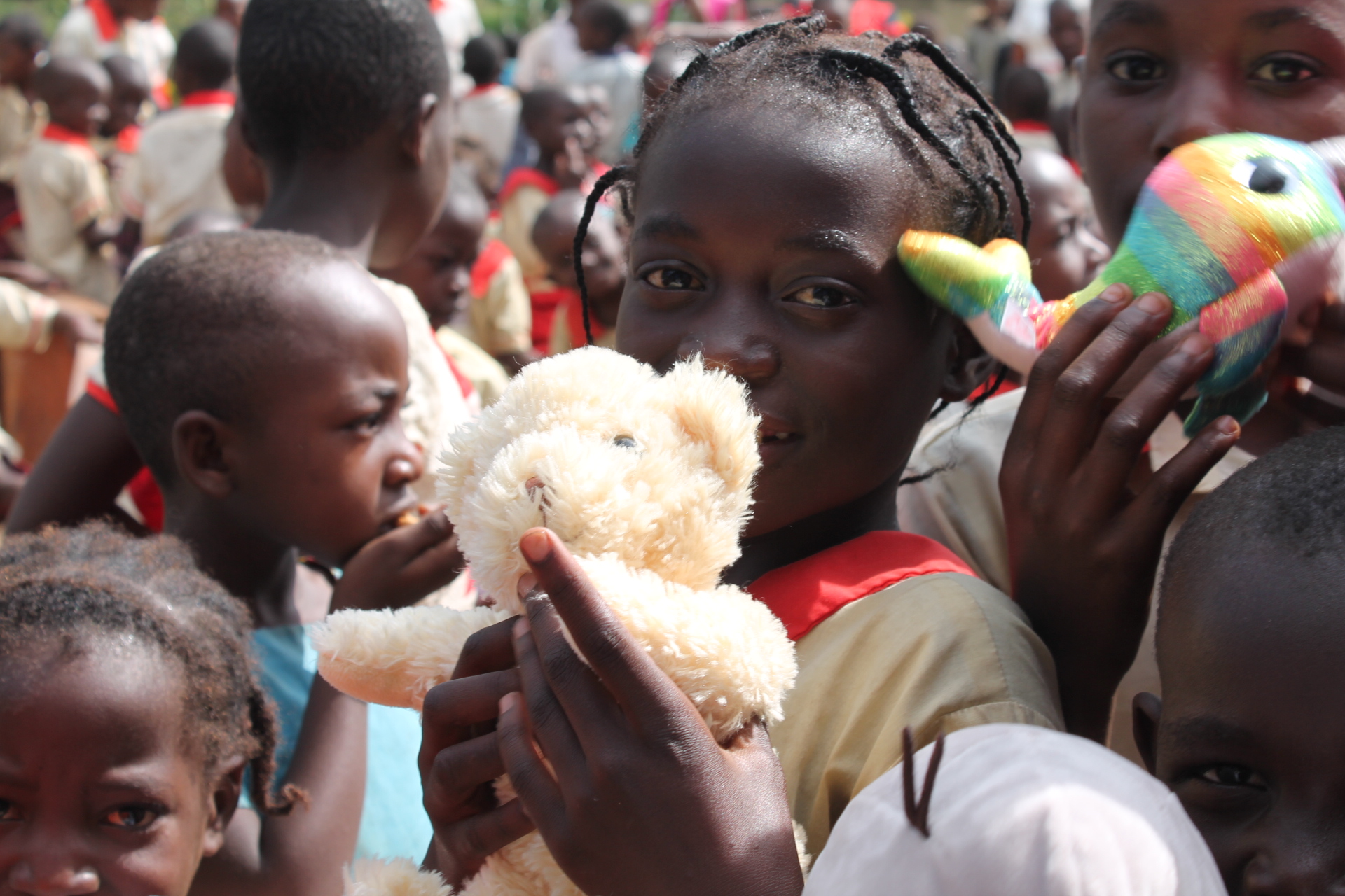 Young girl holding a teddy bear