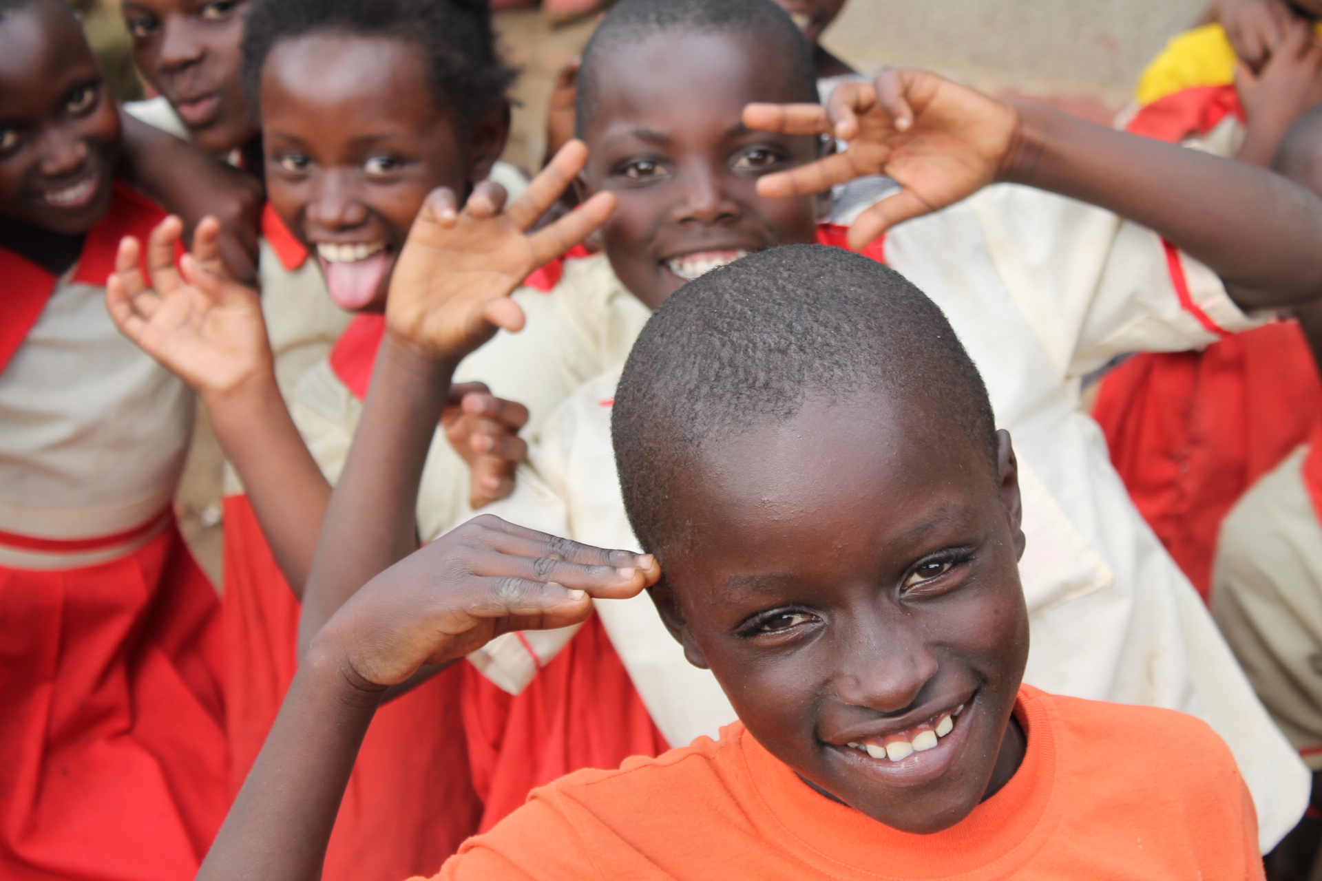 Schoolchildren smiling and waving